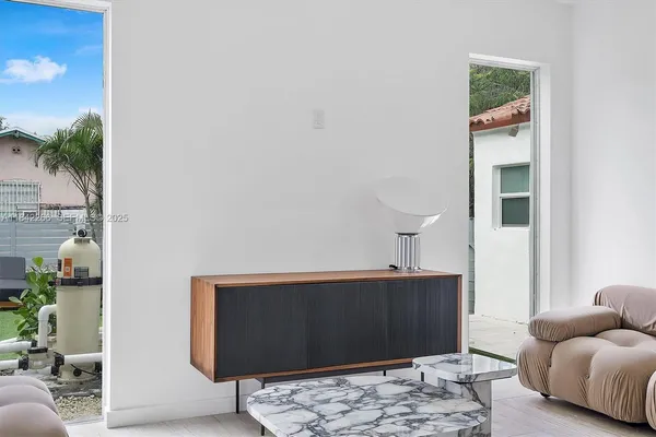a view of a backyard with sitting area