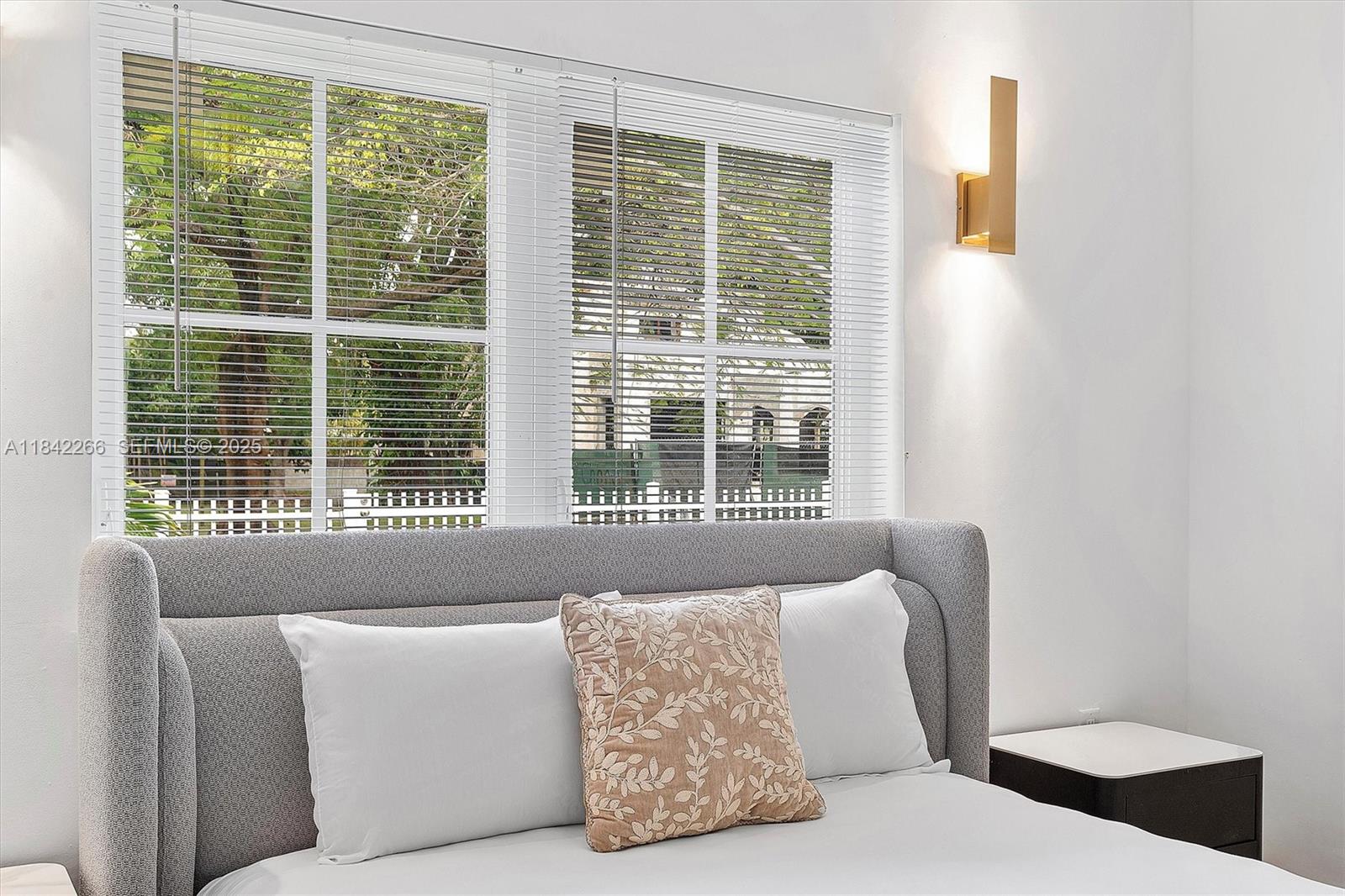 58 Northeast 45th Street Miami, FL 33137 - Photo 34 of 55 a living room with furniture and a window