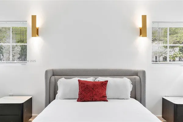 a bedroom with a bed and dresser