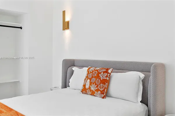 a kitchen with stainless steel appliances a sink microwave and refrigerator