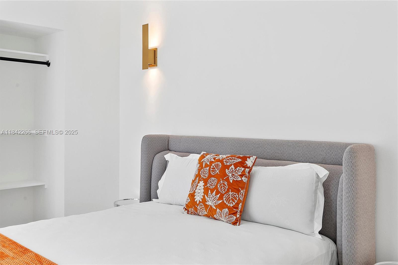 58 Northeast 45th Street Miami, FL 33137 - Photo 40 of 55 a bedroom with a bed and dresser