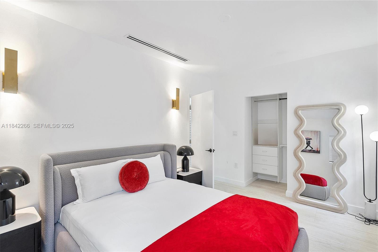 58 Northeast 45th Street Miami, FL 33137 - Photo 52 of 55 a bedroom with a bed and closet