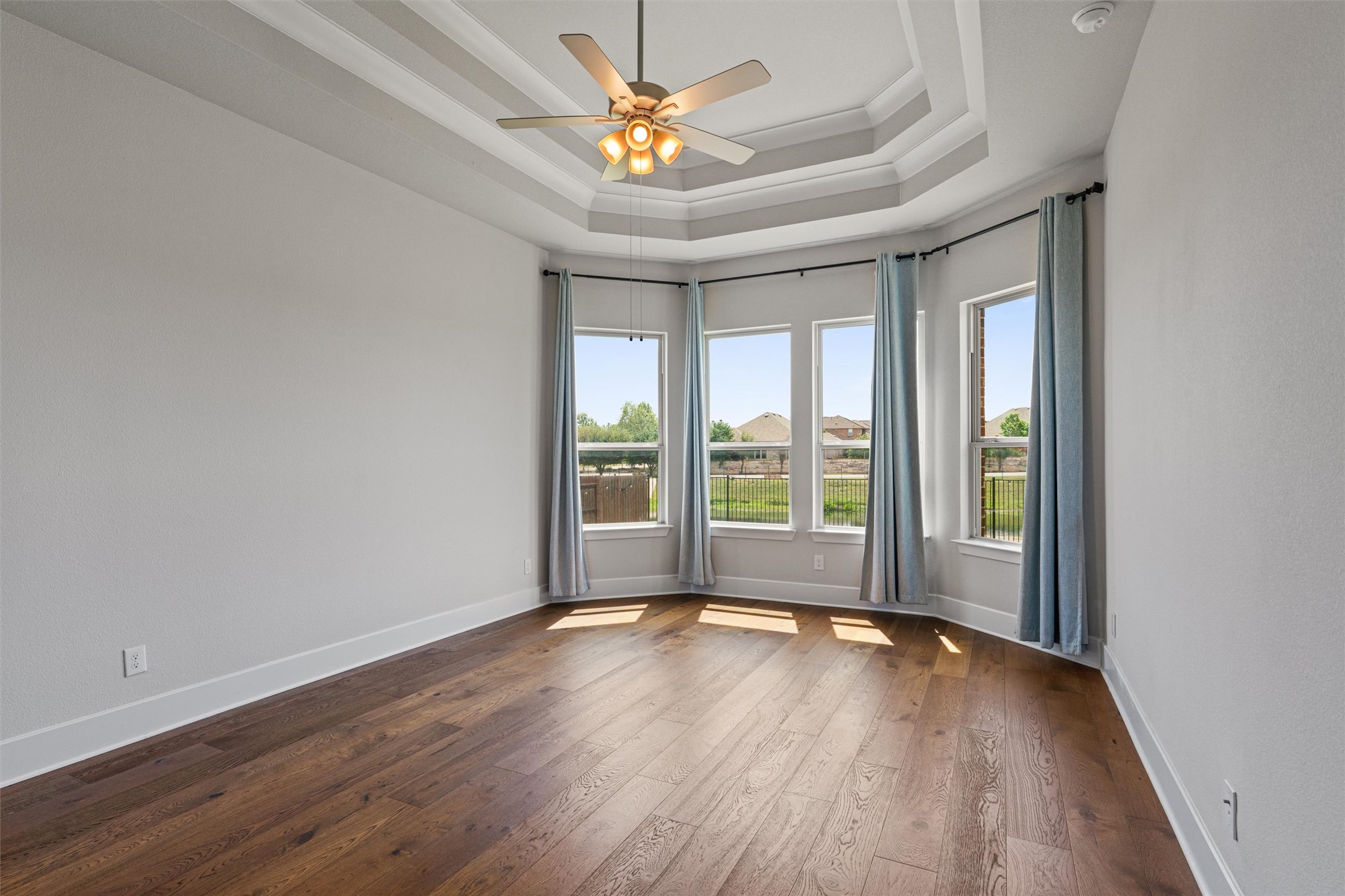 108 Rio Vista Drive Georgetown, TX 78626 - Photo 18 of 40 a view of empty room with wooden floor and fan
