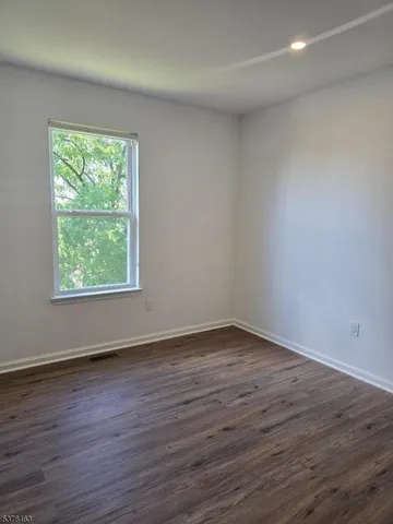 a kitchen with a sink cabinets and window
