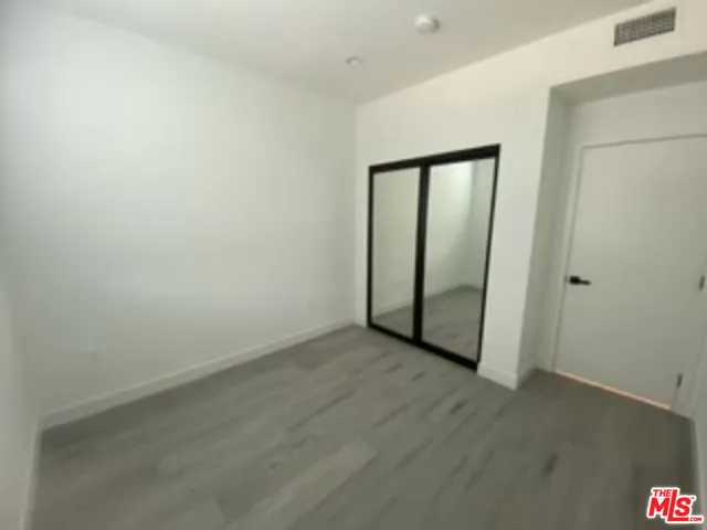 a bathroom with a shower and toilet