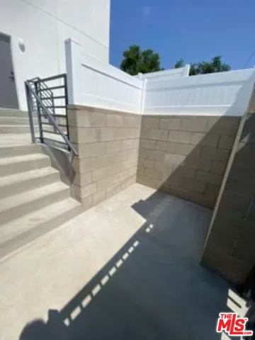 a view of a backyard with sitting area