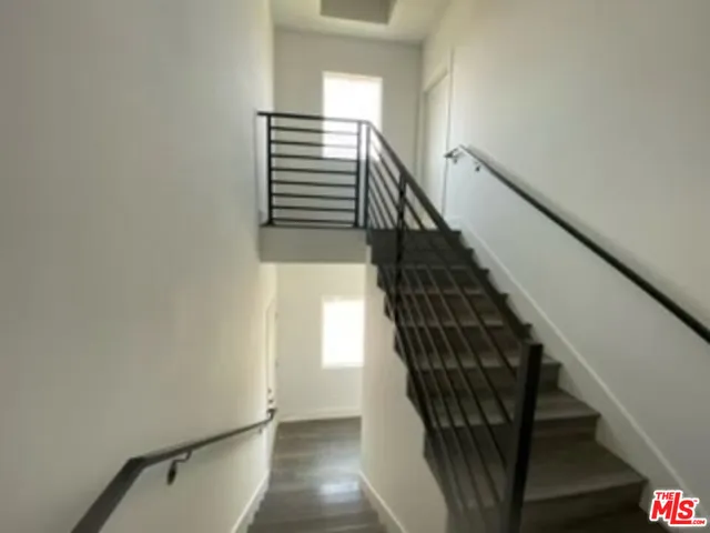 a kitchen with stainless steel appliances a refrigerator sink and cabinets