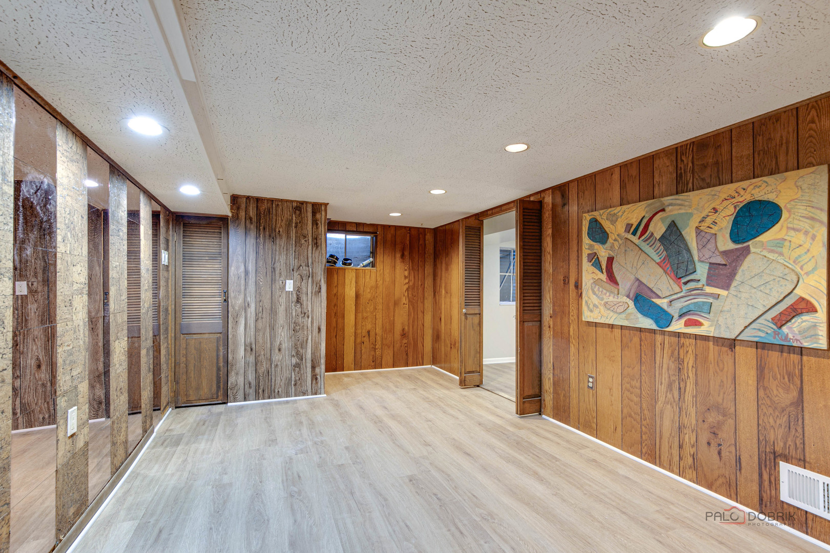 838 Inverrary Lane, Unit 838 Deerfield, IL 60015 - Photo 21 of 25 a view of hallway with wooden walls