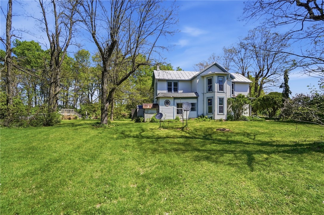 1444 Eagle City Road Springfield, OH 45504 - Photo 6 of 50 This charming home sits amidst a verdant landscape, offering a serene escape.