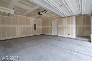 12347 Indigo Montage Road, Unit 3 Las Vegas, NV 89183 - Photo 20 of 23 Ample space for vehicles and storage with an automatic garage door opener.