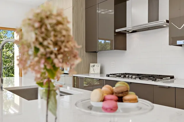 a kitchen with a sink and a stove