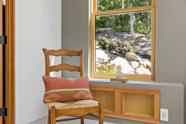 a view of a porch with furniture and a yard