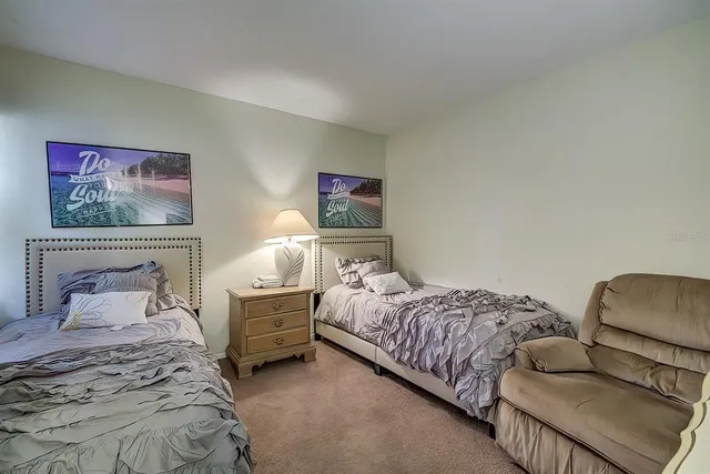 a bedroom with bed and a couch