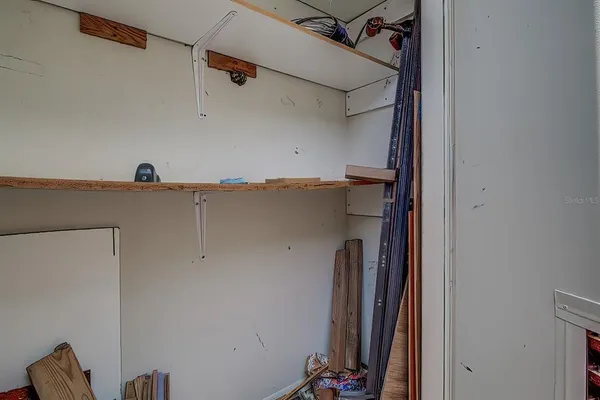 a view of a house with backyard and a tree