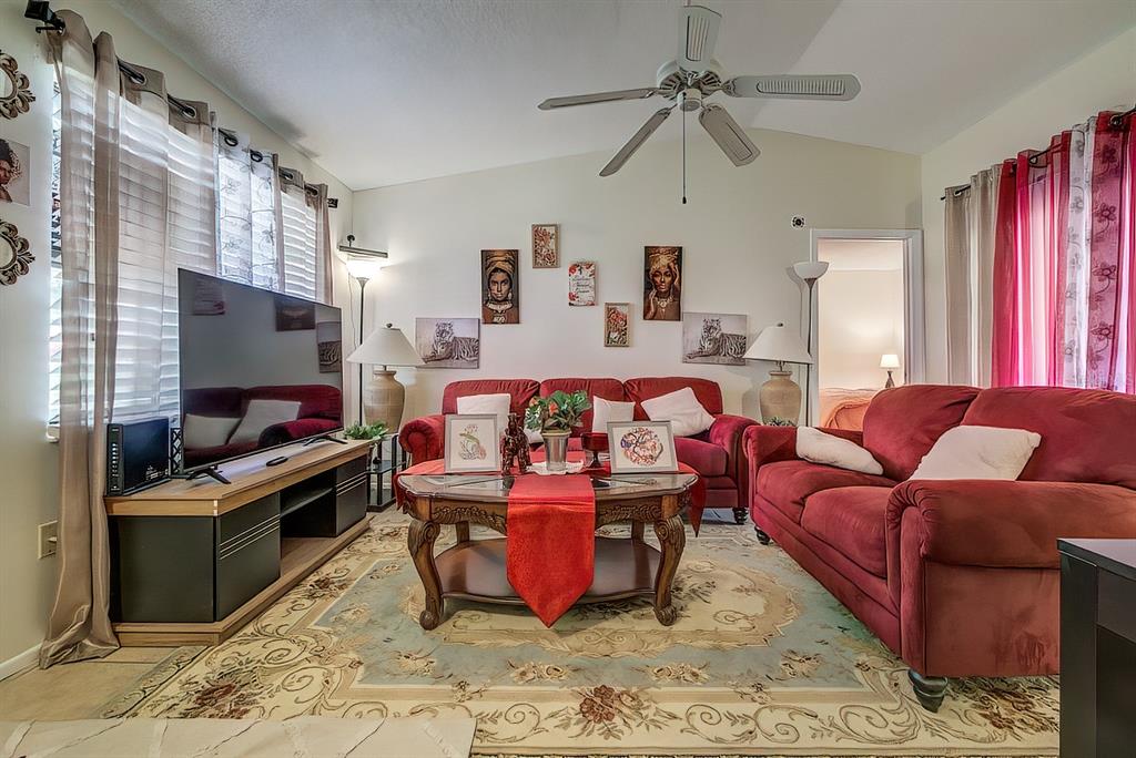 56 Pine Track, Unit 101E Ocala, FL 34472 - Photo 4 of 23 a living room with furniture and a flat screen tv