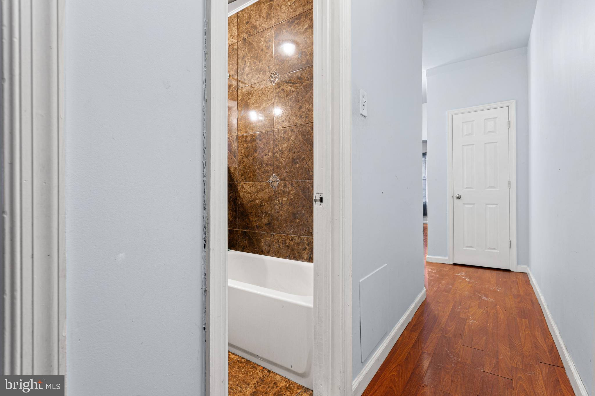 5446 Walnut Street, Unit 1 Philadelphia, PA 19139 - Photo 11 of 15 a view of a bathroom from a hallway