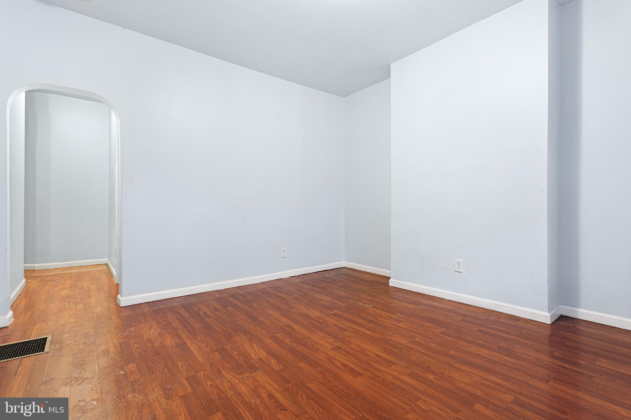 5446 Walnut Street, Unit 1 Philadelphia, PA 19139 - Photo 5 of 15 an empty room with wooden floor and closet