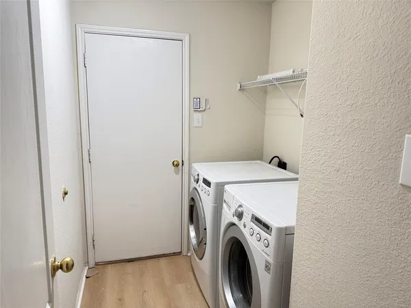 a utility room with dryer and washer