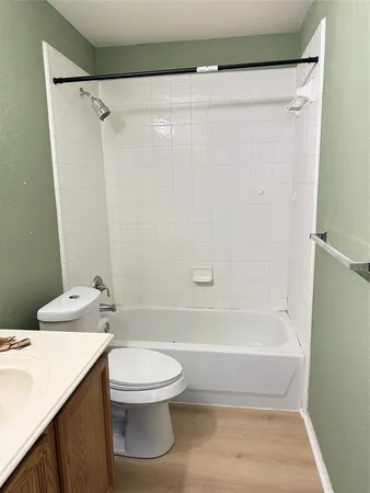 a bathroom with a sink a toilet and a bathtub
