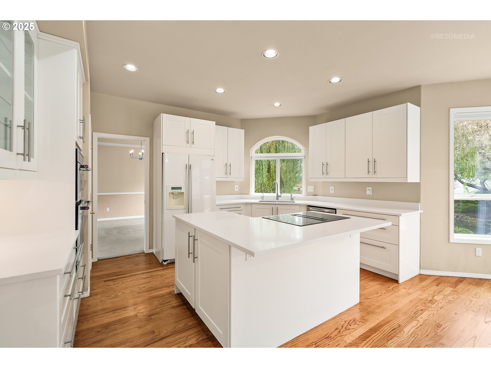 2525 Northwest 141st Place Portland, OR 97229 - Photo 13 of 48 a kitchen with stainless steel appliances granite countertop a sink stove and refrigerator