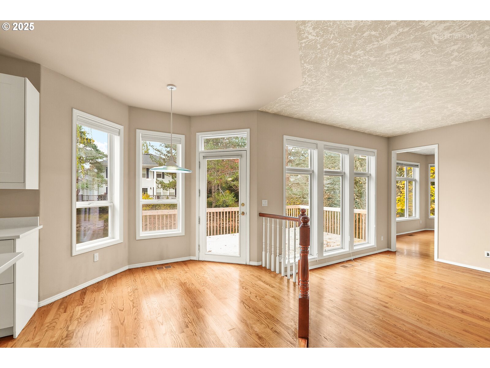 2525 Northwest 141st Place Portland, OR 97229 - Photo 17 of 48 a view of an empty room with wooden floor and a window
