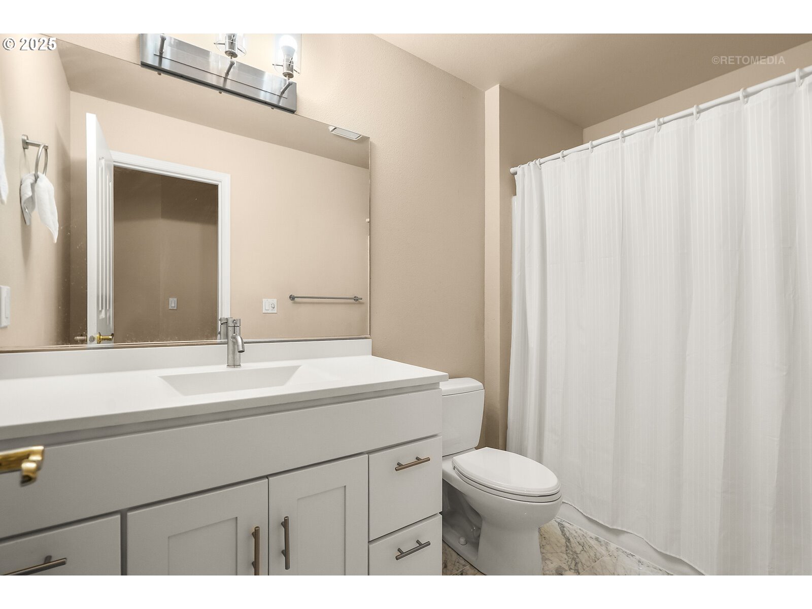 2525 Northwest 141st Place Portland, OR 97229 - Photo 37 of 48 a bathroom with a toilet a sink and a mirror