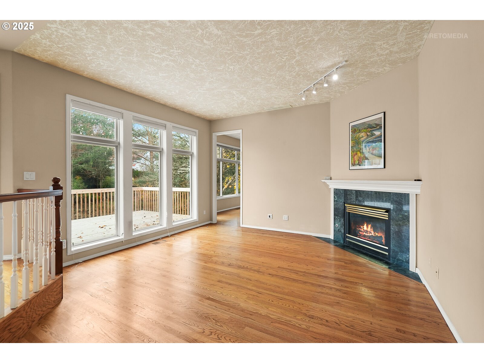 2525 Northwest 141st Place Portland, OR 97229 - Photo 7 of 48 a view of an empty room with wooden floor and a window