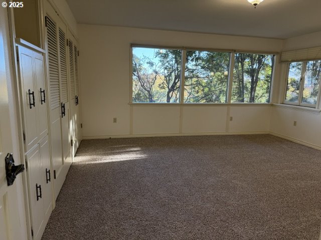 681 College Street Milton Freewater, OR 97862 - Photo 11 of 27 an empty room with a fireplace and large window