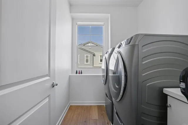 a bathroom with a sink a toilet a mirror and shower curtain