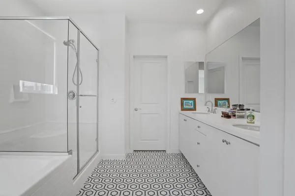 a bathroom with a bathtub and a shower