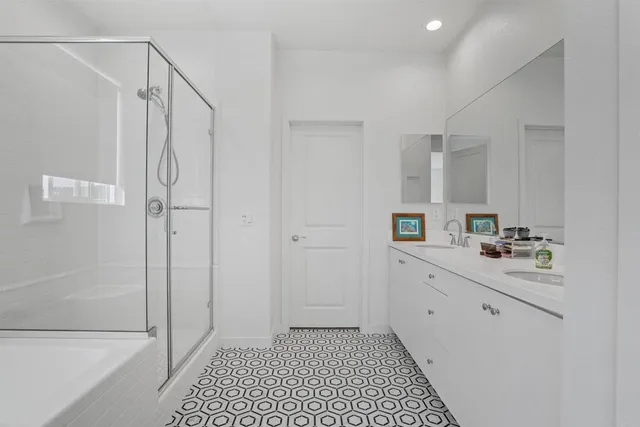 a bathroom with a bathtub and a shower