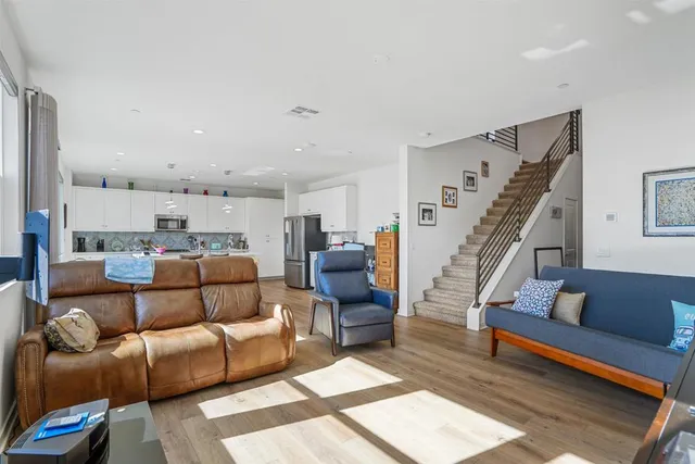 a living room with furniture and a rug