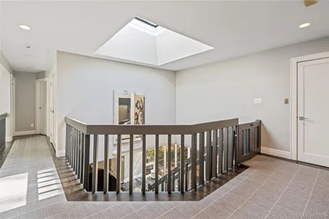 a view of hallway with wooden floor