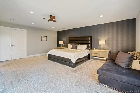 a bedroom with a bed and a couch