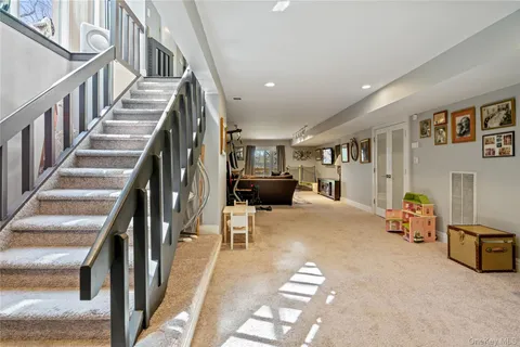 a view of livingroom with furniture and stairs