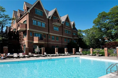 a view of pool with outdoor seating