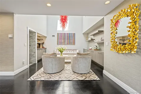 a view of an entryway and livingroom with furniture