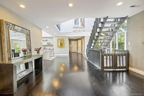 a view of an entryway with wooden floor