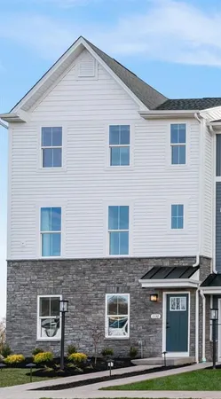 a front view of building with yard