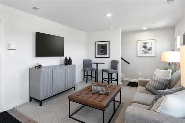a living room with furniture and a window