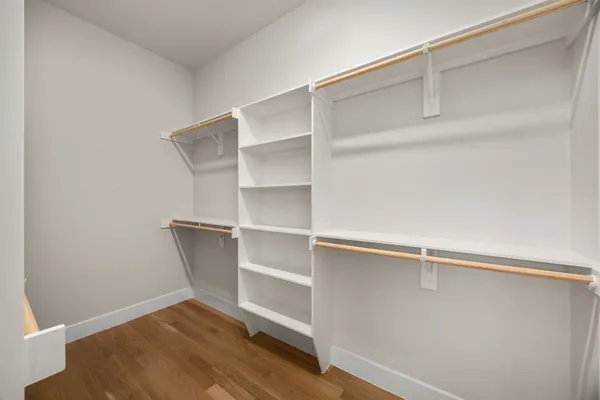 a view of an empty walk in closet