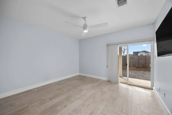 a utility room with a couch and a table