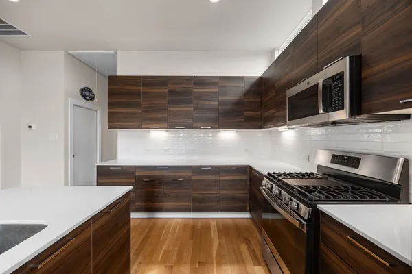 a kitchen with a stove and a microwave
