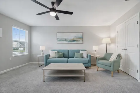 a living room with furniture and a window