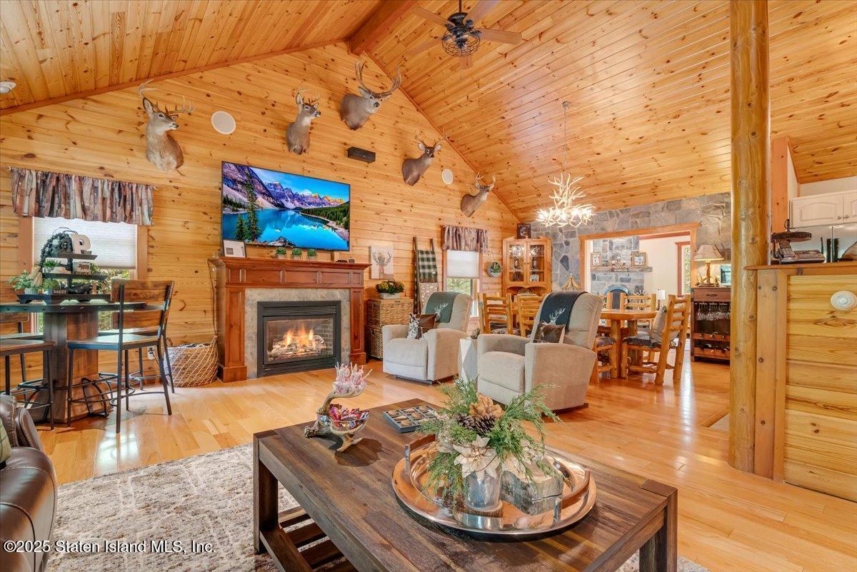 134 Split Rock Road Dingmans Ferry, PA 18328 - Photo 11 of 84 a living room with furniture and a fireplace