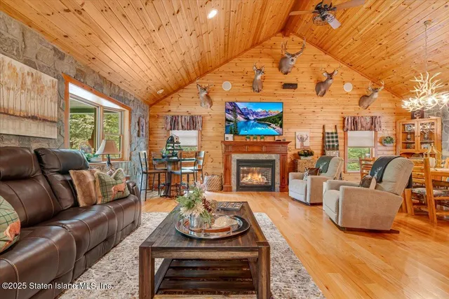 a view of a hallway with wooden floor and entryway