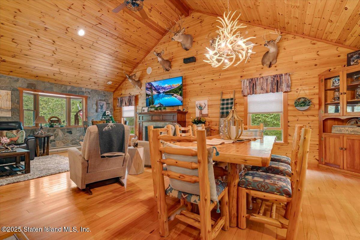 134 Split Rock Road Dingmans Ferry, PA 18328 - Photo 15 of 84 a view of a livingroom with furniture and a floor to ceiling window