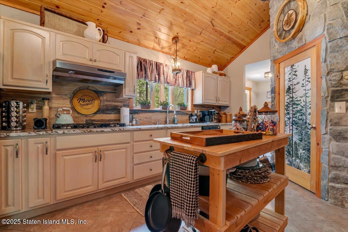 134 Split Rock Road Dingmans Ferry, PA 18328 - Photo 22 of 84 a kitchen with stainless steel appliances granite countertop a sink and cabinets
