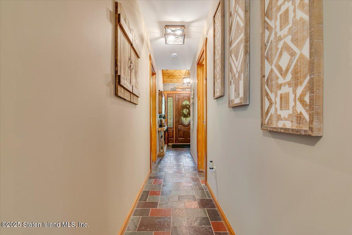 134 Split Rock Road Dingmans Ferry, PA 18328 - Photo 27 of 84 a view of a hallway with wooden floor and entryway
