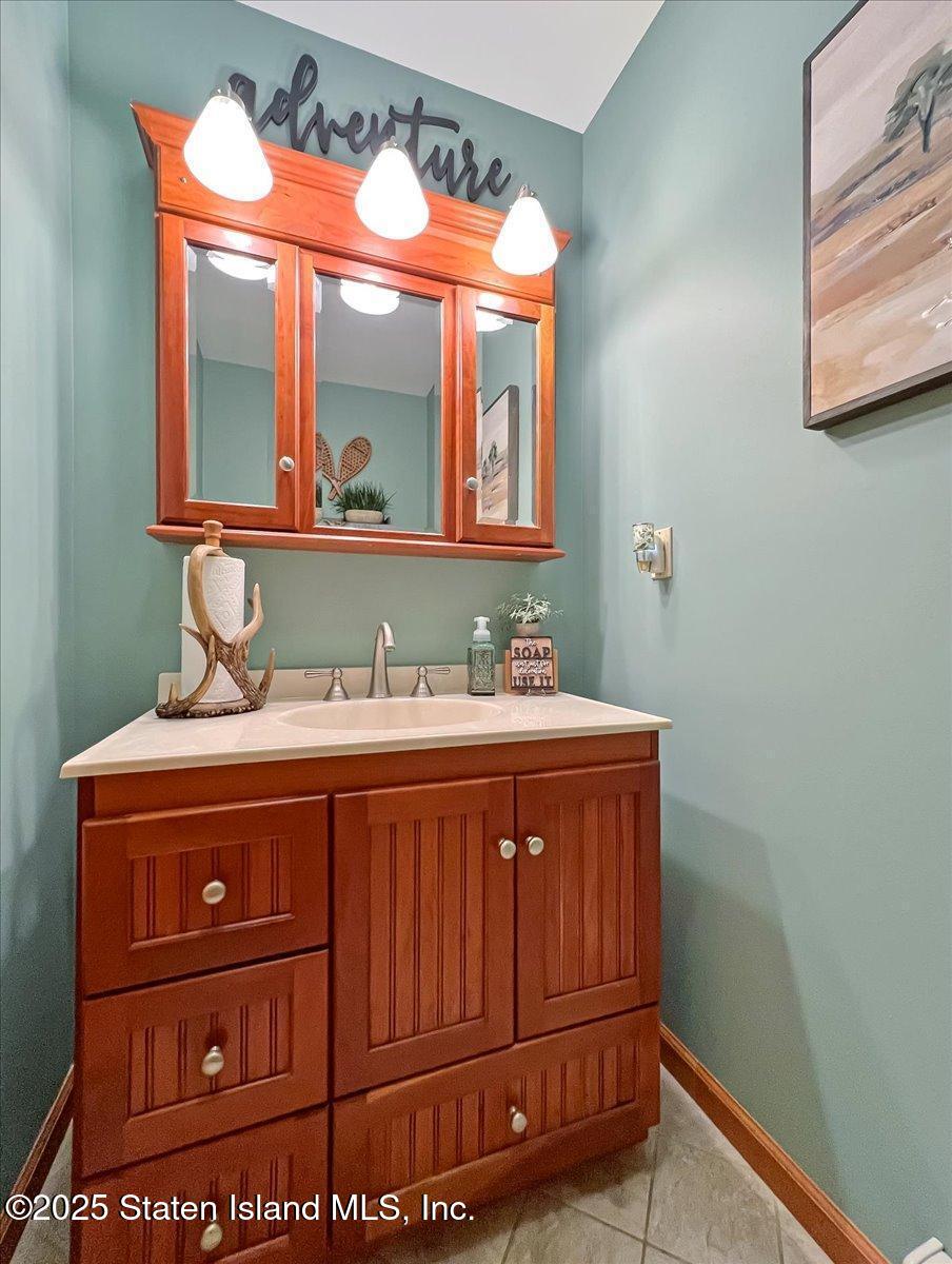 134 Split Rock Road Dingmans Ferry, PA 18328 - Photo 28 of 84 a bathroom with a sink and a mirror